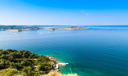 Scenic view of sea against blue sky