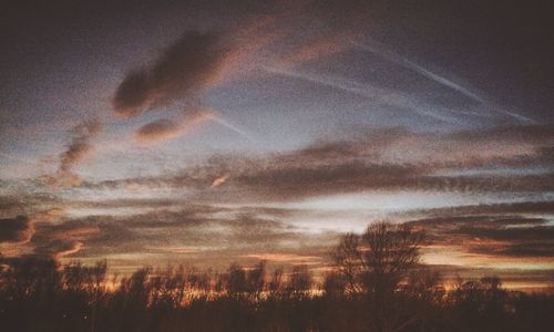 Scenic view of landscape against cloudy sky