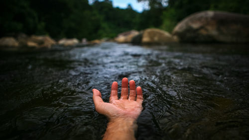 Low section of person legs in water