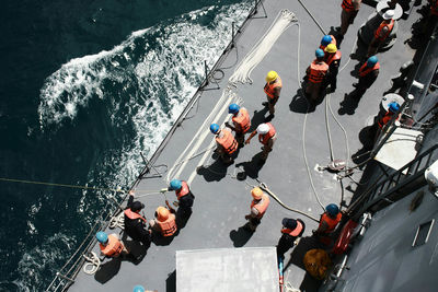 High angle view of men on water