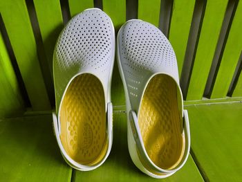 Close-up of yellow shoes on plant