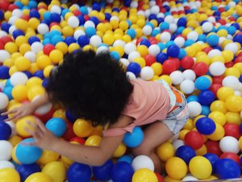 High angle view of boy playing with ball