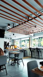 Empty chairs and tables in cafe