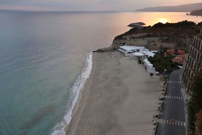 High angle view of beach against sky during sunset