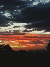 Silhouette landscape against scenic sky