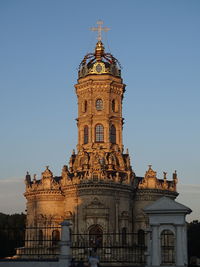 Low angle view of clock tower against sky
