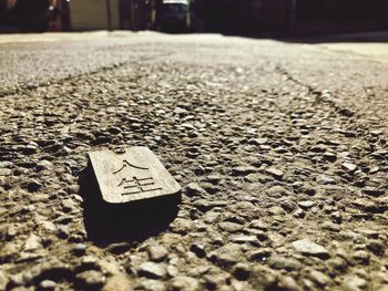 Close-up of arrow symbol on street