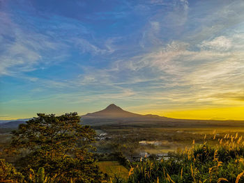 Scenic view of landscape against sky during sunset