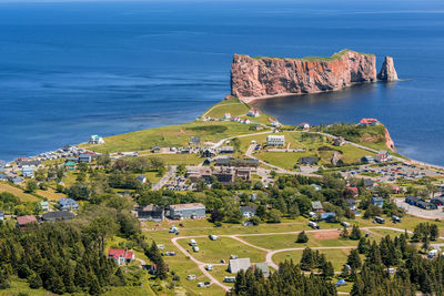 High angle view of buildings by sea