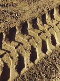 High angle view of text on sand