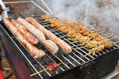 Close-up of meat on barbecue grill