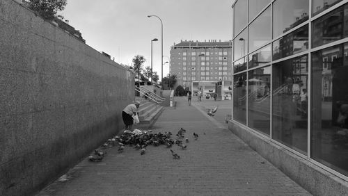 Man walking on street in city