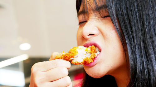 Close-up of woman eating food