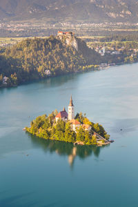 Scenic view of lake by building