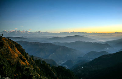Scenic view of mountains against sky during sunset