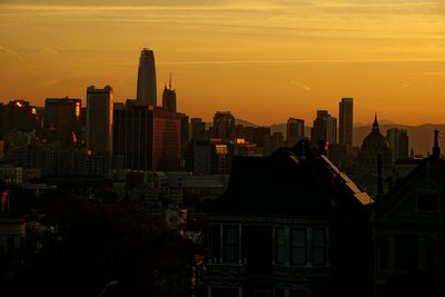 Silhouette of city at sunset