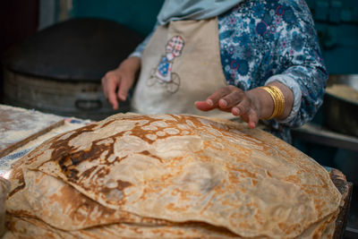 Midsection of woman preparing food