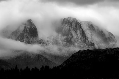 Scenic view of mountains against sky during winter