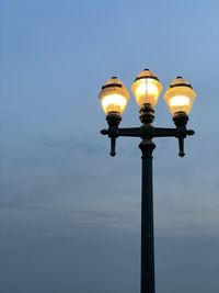 Low angle view of street light against sky