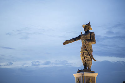 Low angle view of statue against sky