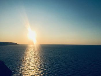 Scenic view of sea against clear sky during sunset
