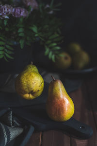 High angle view on levitating pears wooden table rustic style