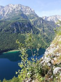 Scenic view of lake and mountains against sky