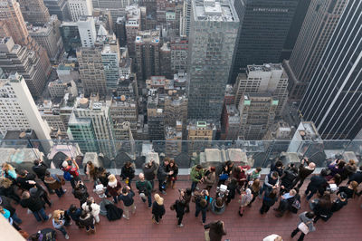 High angle view of people on building terrace in city