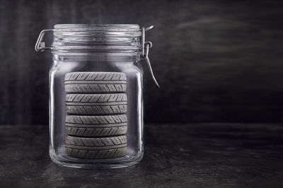 Close-up of tires in glass jar on table