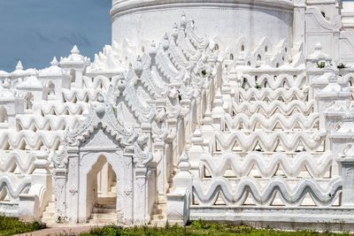 Close-up of limestone pagoda against blue sky