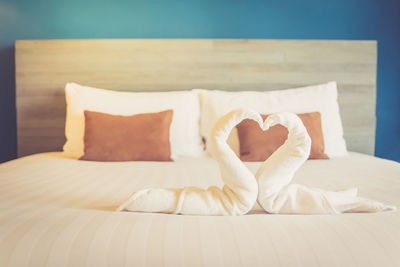 Close-up of heart shape on bed