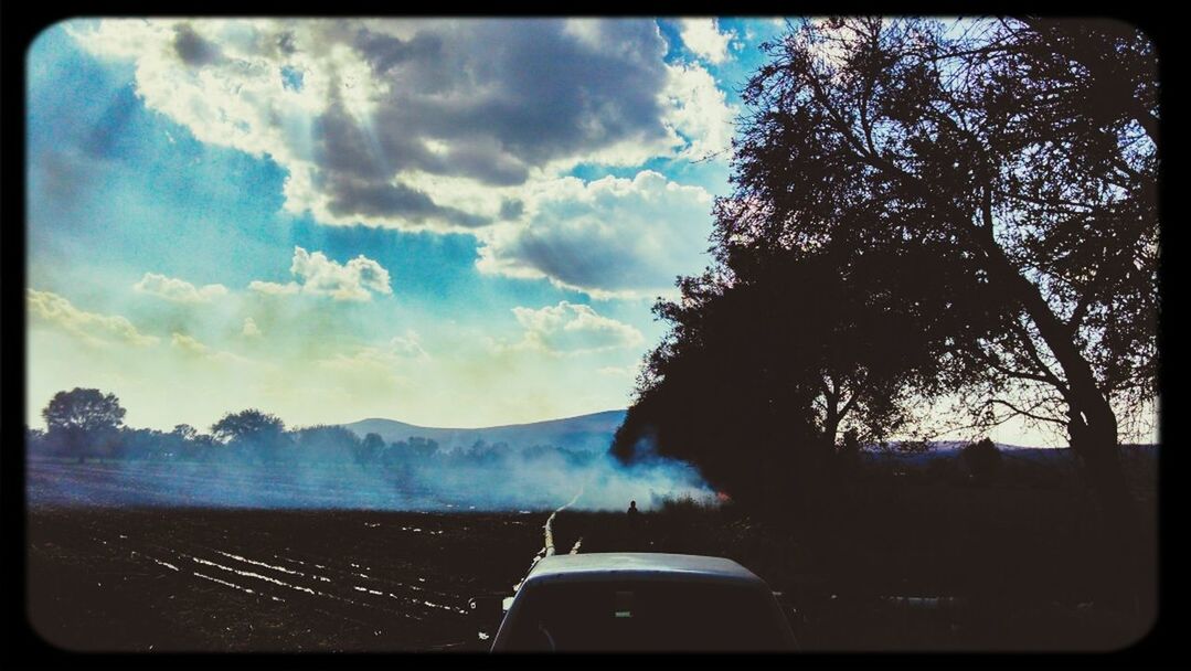 transfer print, sky, transportation, auto post production filter, tree, mode of transport, car, land vehicle, cloud - sky, cloud, silhouette, mountain, tranquil scene, tranquility, scenics, nature, landscape, travel, road, beauty in nature