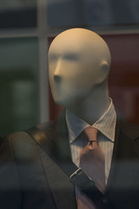 Close-up of male mannequin wearing suit