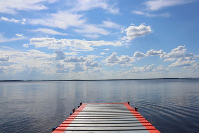 Pier over lake against sky