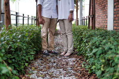 Couple standing at the gravel path