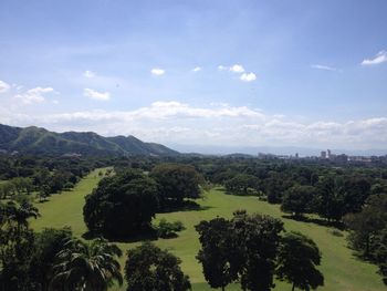 Scenic view of landscape against cloudy sky