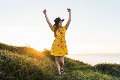 Full length of woman standing on field