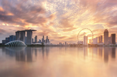 Scenic view of cityscape against sky during sunset