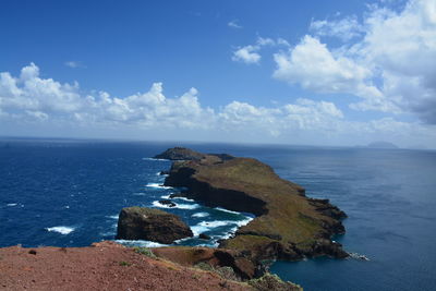 Scenic view of sea against blue sky