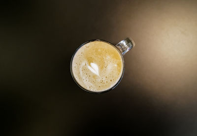 Directly above shot of coffee cup on table