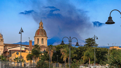 Low angle view of the church against the sky devastated by the eruption of the etna volcano