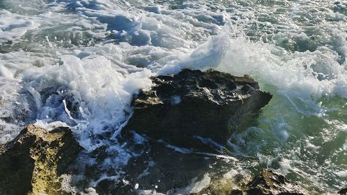 Waves splashing on rocks