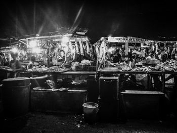 Crowd at market stall at night