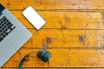 High angle view of smart phone on table