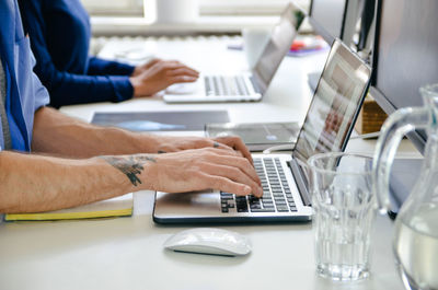 Man using laptop on table