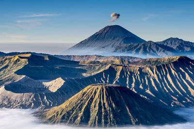 Scenic view of volcanic crater against sky