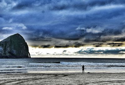 Scenic view of sea against cloudy sky