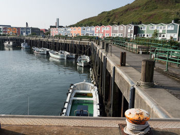 Boats moored at harbor