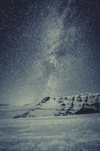 View of landscape during snowstorm