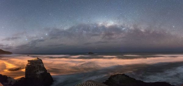 Scenic view of sea against sky at night